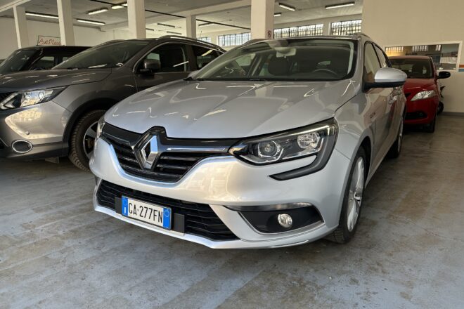 A silver Renault SUV in a car showroom, with other cars parked beside it inside a brightly lit indoor space, license plate GA-277FN visible at the front.