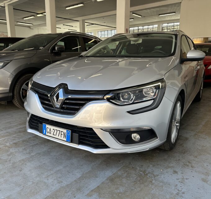 A silver Renault SUV in a car showroom, with other cars parked beside it inside a brightly lit indoor space, license plate GA-277FN visible at the front.