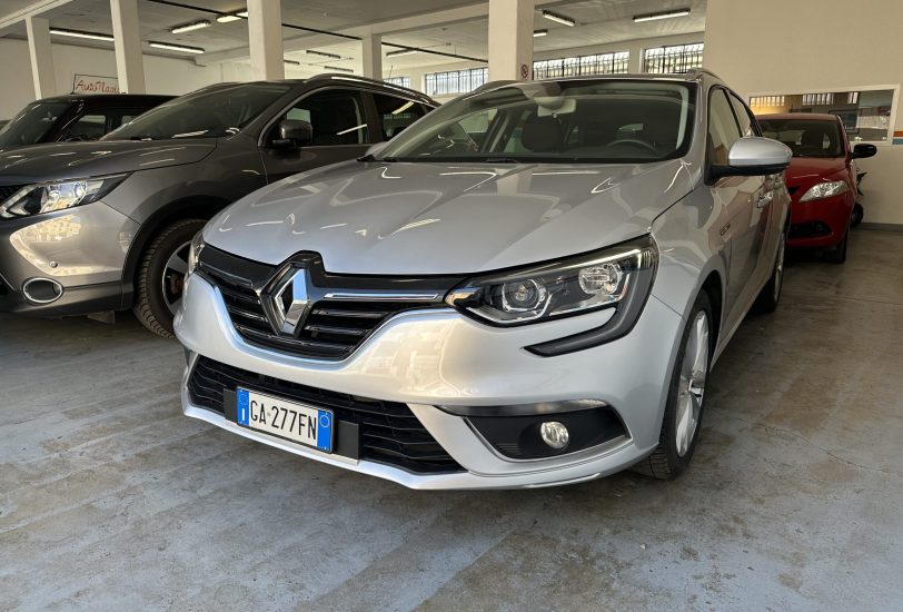 A silver Renault SUV in a car showroom, with other cars parked beside it inside a brightly lit indoor space, license plate GA-277FN visible at the front.