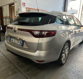 Silver Renault Megane estate car parked in a garage, rear view with visible license plate GA-277FN and taillights intact